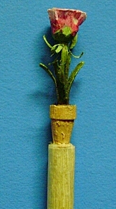 hand carved flower in a pot toothpick