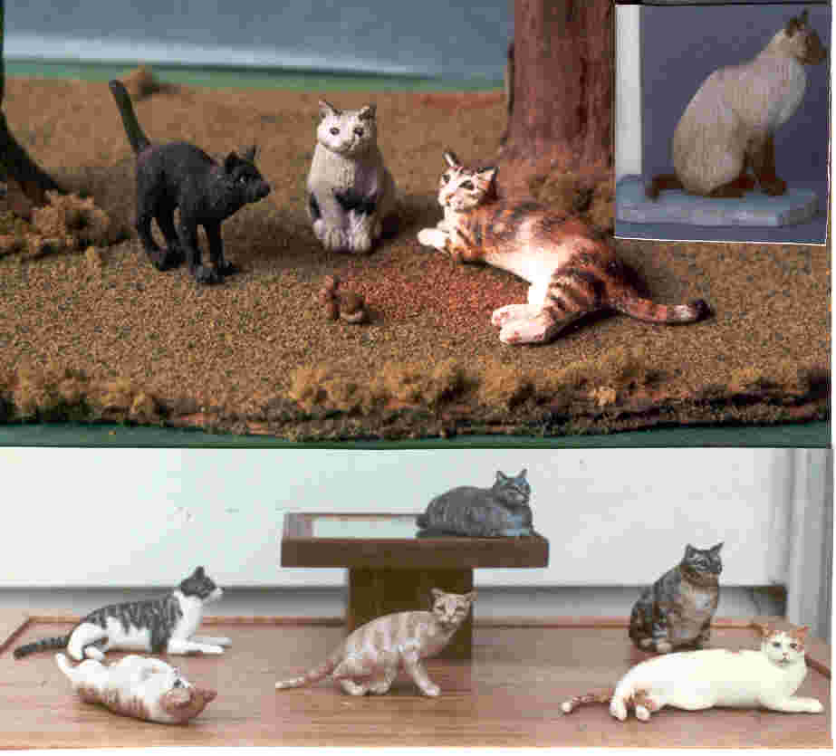 handcarved  wooden miniature cats